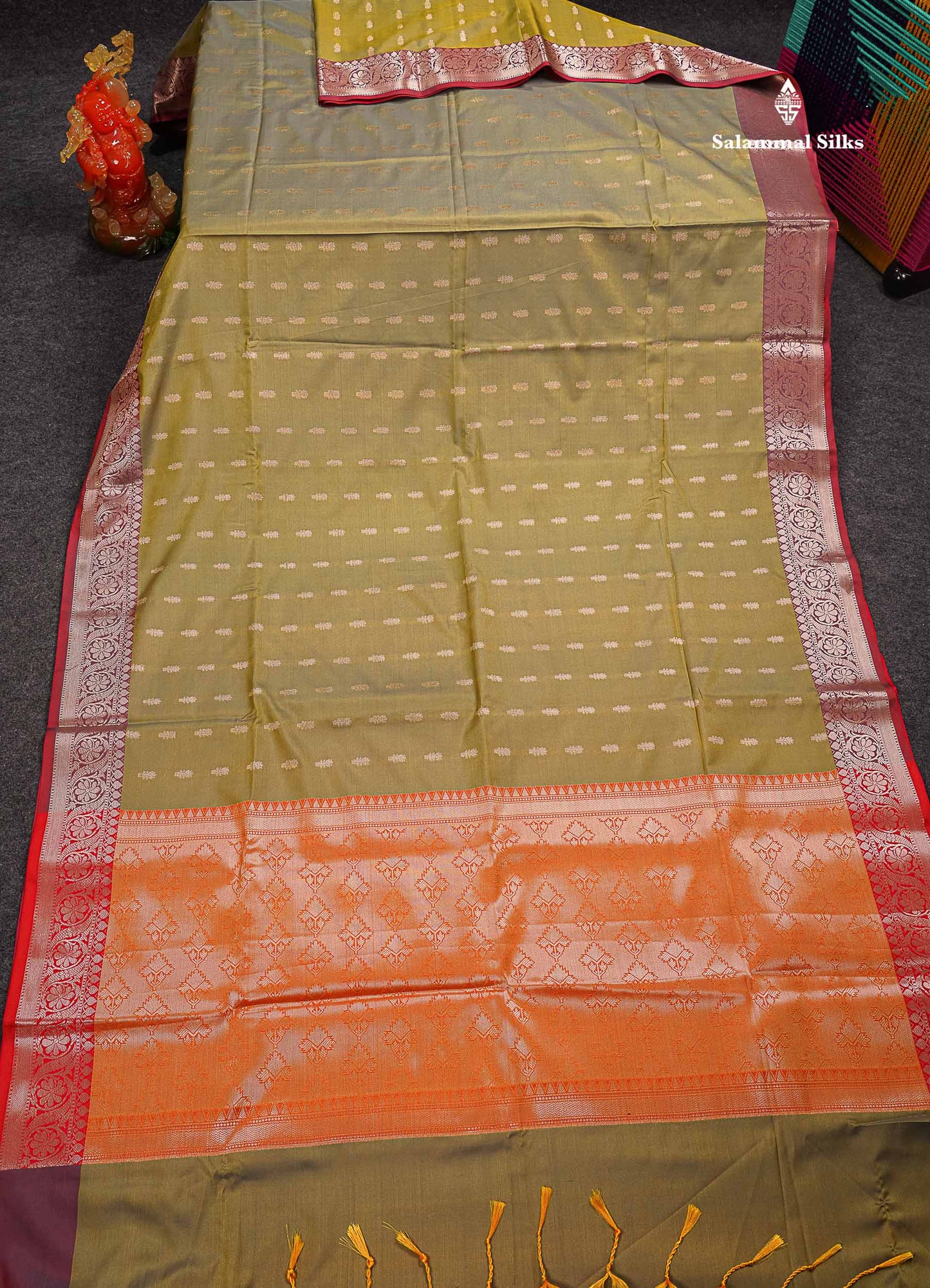 Beautiful Dual Tone Olive Green Zari Butta Semi Soft Silk Saree With Contrast Orange Blouse