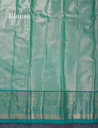 Dark Peach Geometric Pattern Tissue Bridal Semi Silk Saree With Contrast Peacock Green Traditional Border