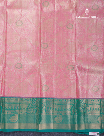 Dark Peach Geometric Pattern Tissue Bridal Semi Silk Saree With Contrast Peacock Green Traditional Border