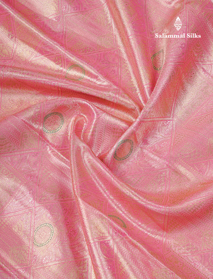 Dark Peach Geometric Pattern Tissue Bridal Semi Silk Saree With Contrast Peacock Green Traditional Border