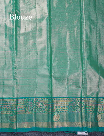 Dark Peach Geometric Pattern Tissue Bridal Semi Silk Saree With Contrast Peacock Green Traditional Border