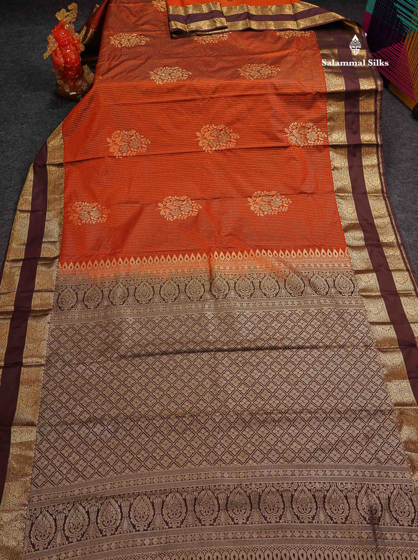 Beautiful Rust Orange Zari Line With Butta Semi Silk Saree With Contrast Dark Brown Traditional Gap Border