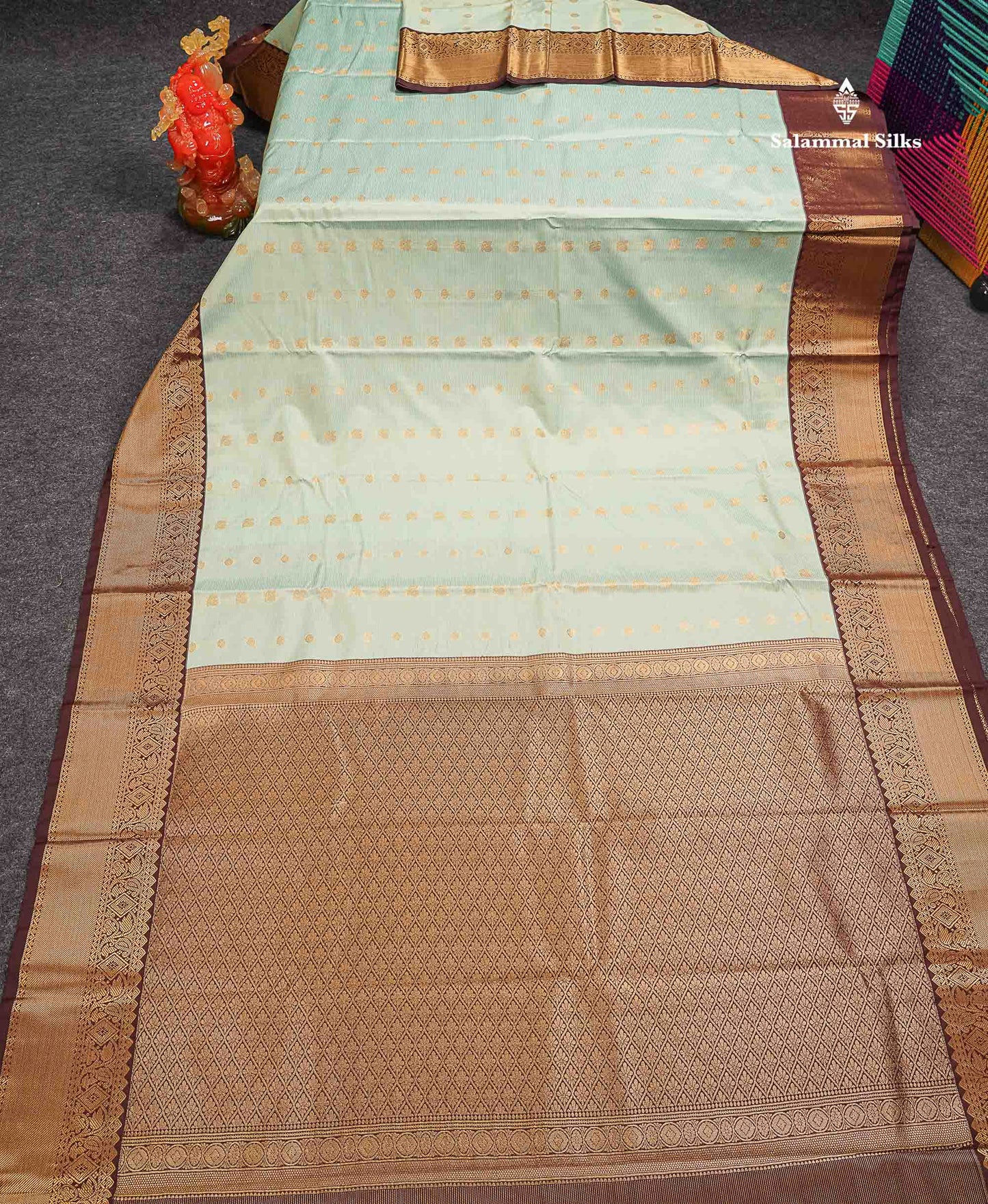 Beautiful Light Elaichi Green Vaira Oosi Lines With Traditional Buttas Semi Silk Saree With Contrast Dark Brown Border