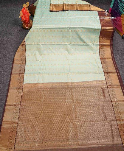 Beautiful Light Elaichi Green Vaira Oosi Lines With Traditional Buttas Semi Silk Saree With Contrast Dark Brown Border