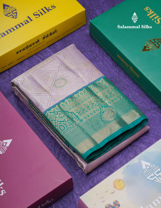 Lavender Geometric Pattern Tissue Bridal Semi Silk Saree With Contrast Peacock Green Traditional Border