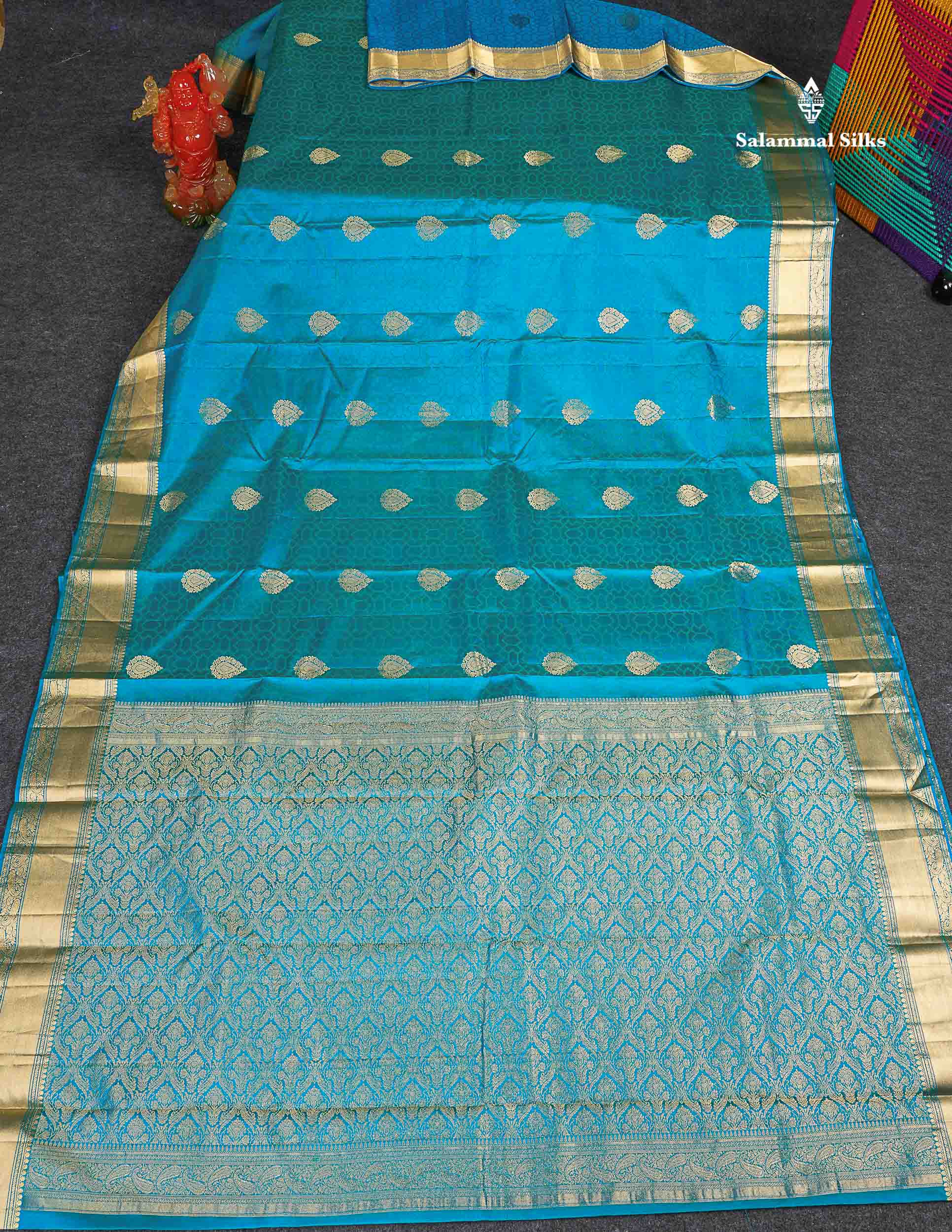 Pure Kanjivaram Silk Saree - Peacock  Blue Colour Body Zari Butta With Medium Border