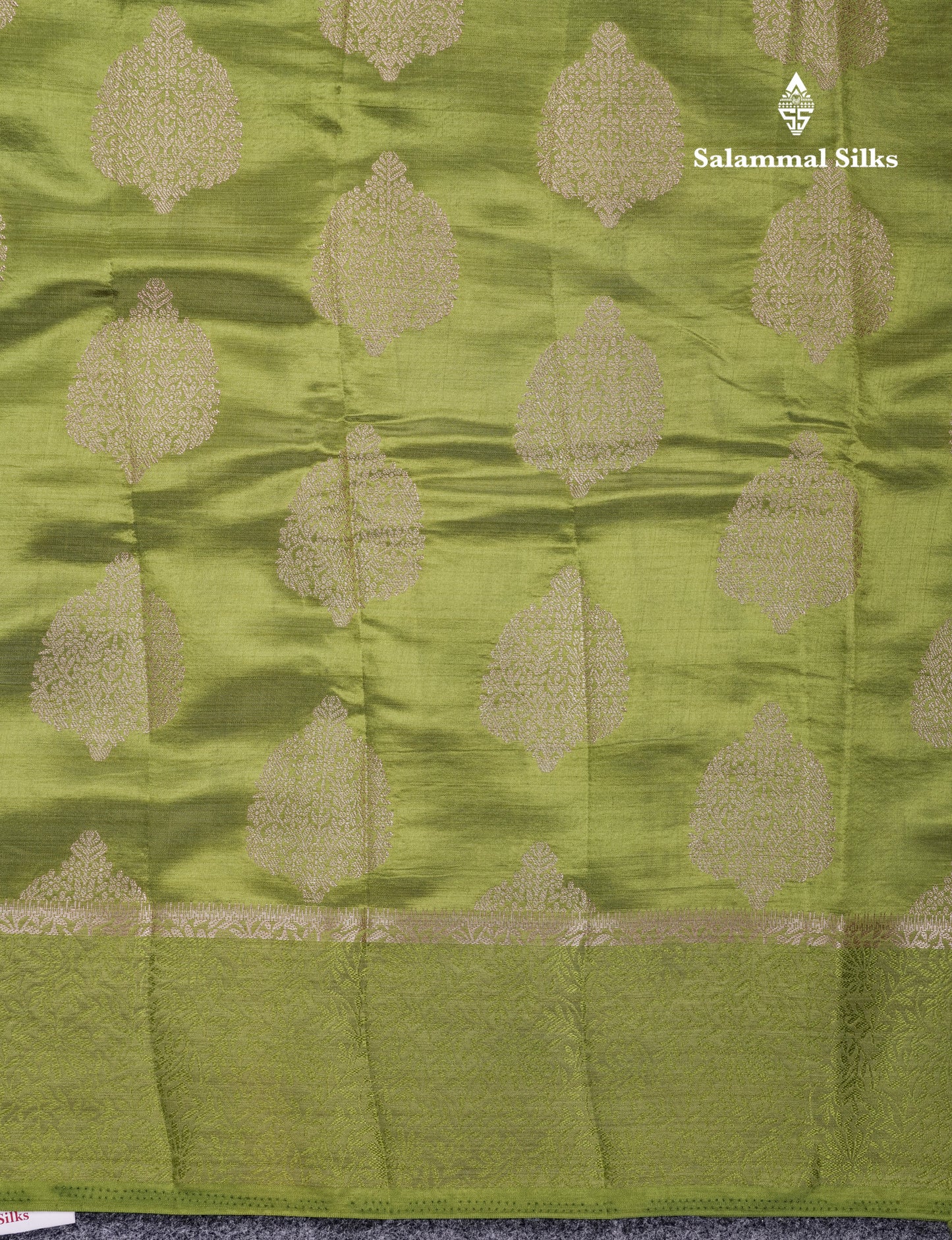 Beautiful Green Semi Raw Silk Saree With Fancy Border