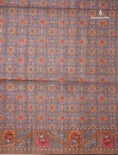 Beautiful Light Grey Semi Tussar Saree With Contrast Brown Floral Design Blouse