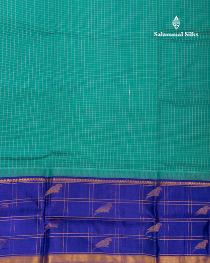 Sapphire Green Small Checks Pure Silk Cotton Saree With Contrast Long Violet Border & Parrot Motifs