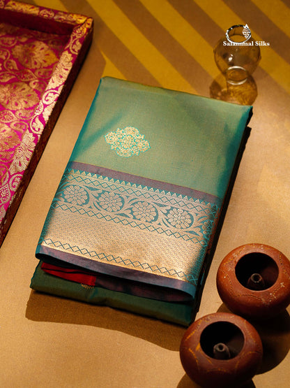 Beautiful Dual Tone Sapphire Green Zari Butta Semi Silk Saree With Contrast Orange Blouse