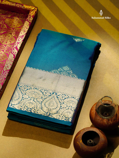 Beautiful Dual Tone Peacock Blue Zari Butta Semi Silk Saree With Traditional Border