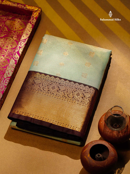 Beautiful Light Elaichi Green Vaira Oosi Lines With Traditional Buttas Semi Silk Saree With Contrast Dark Brown Border