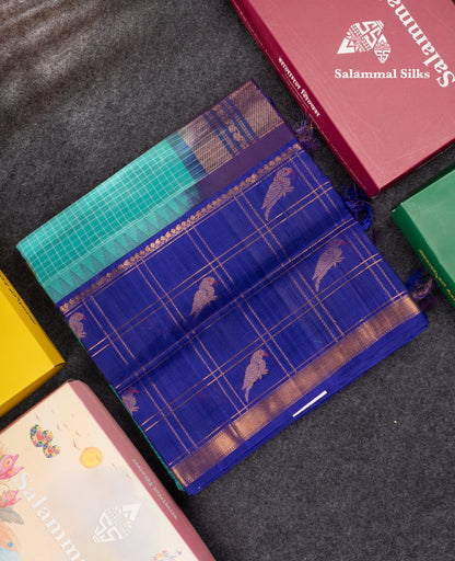 Sapphire Green Small Checks Pure Silk Cotton Saree With Contrast Long Violet Border & Parrot Motifs