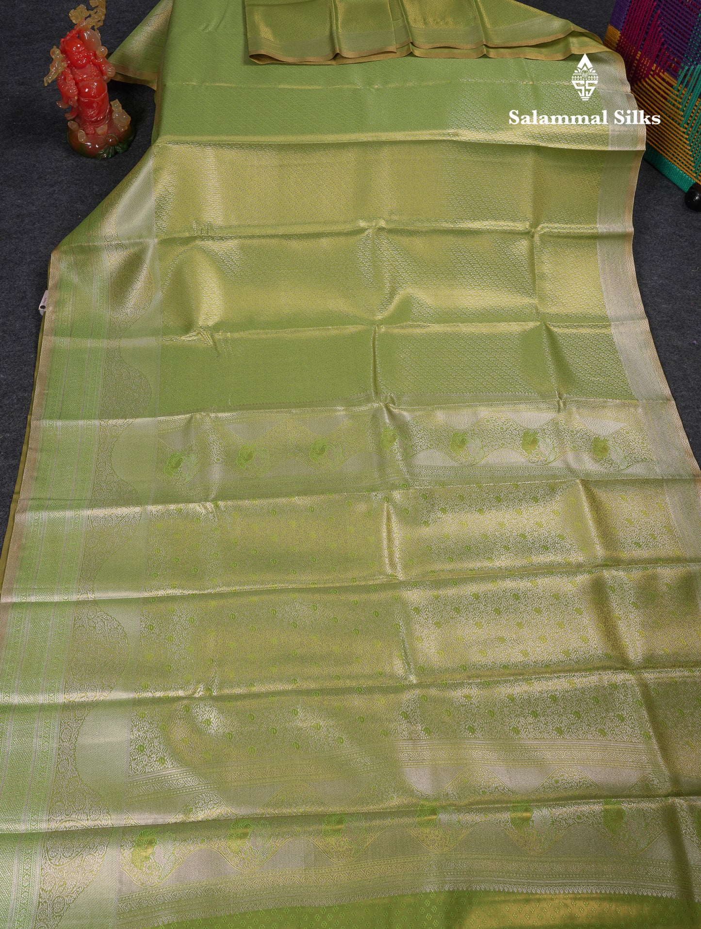 Beautiful Parrot Green Tissue Semi Silk Saree With Fancy Evening Morning Border