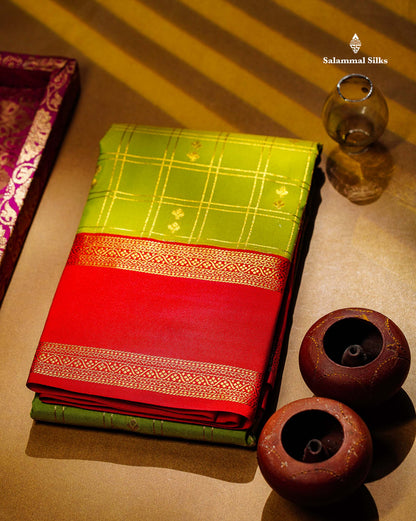 Semi Silk Saree - Parrot Green Butta With Checks Along With Contrast Red Traditional Gap Border