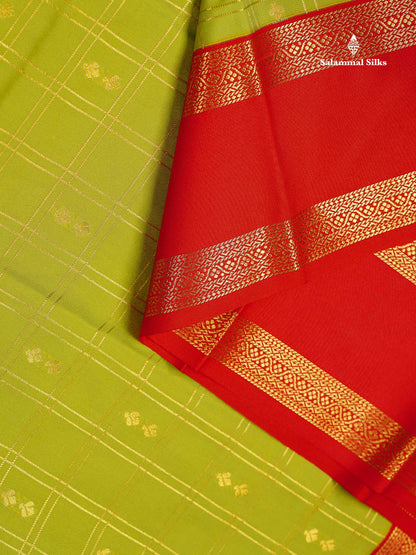 Semi Silk Saree - Parrot Green Butta With Checks Along With Contrast Red Traditional Gap Border