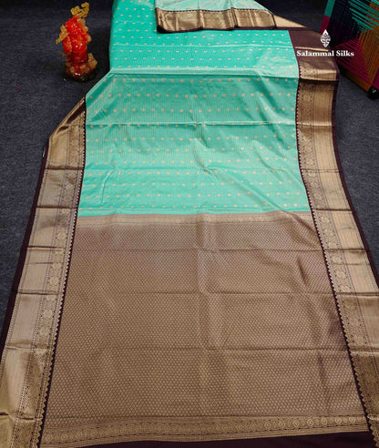 Semi Silk Saree - Mustard Yellow Butta With Vaira Oosi Lines Along With Contrast Dark Brown Traditional Border