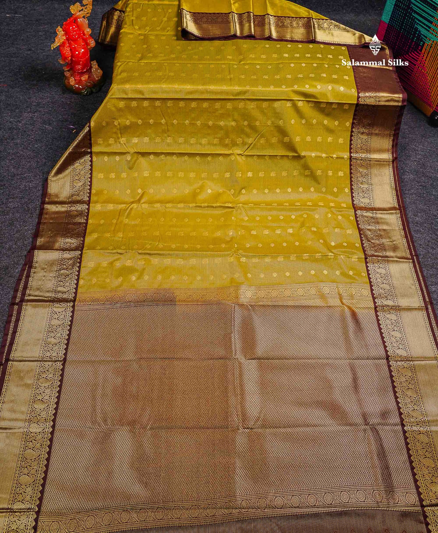 Semi Silk Saree - Olive Mustard Yellow Traditional Butta With Vaira Oosi Lines Along With Contrast Dark Brown Border