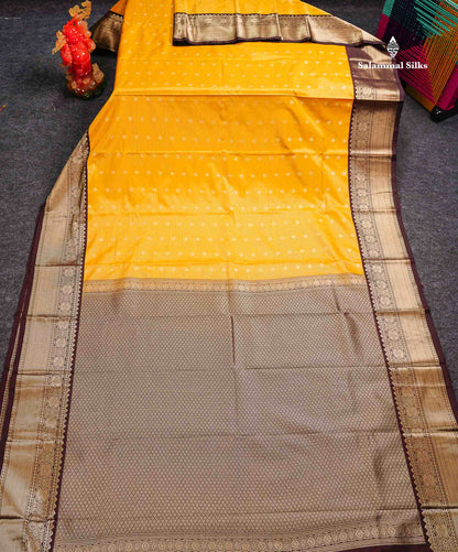 Semi Silk Saree - Mustard Yellow Butta With Vaira Oosi Lines Along With Contrast Dark Brown Traditional Border