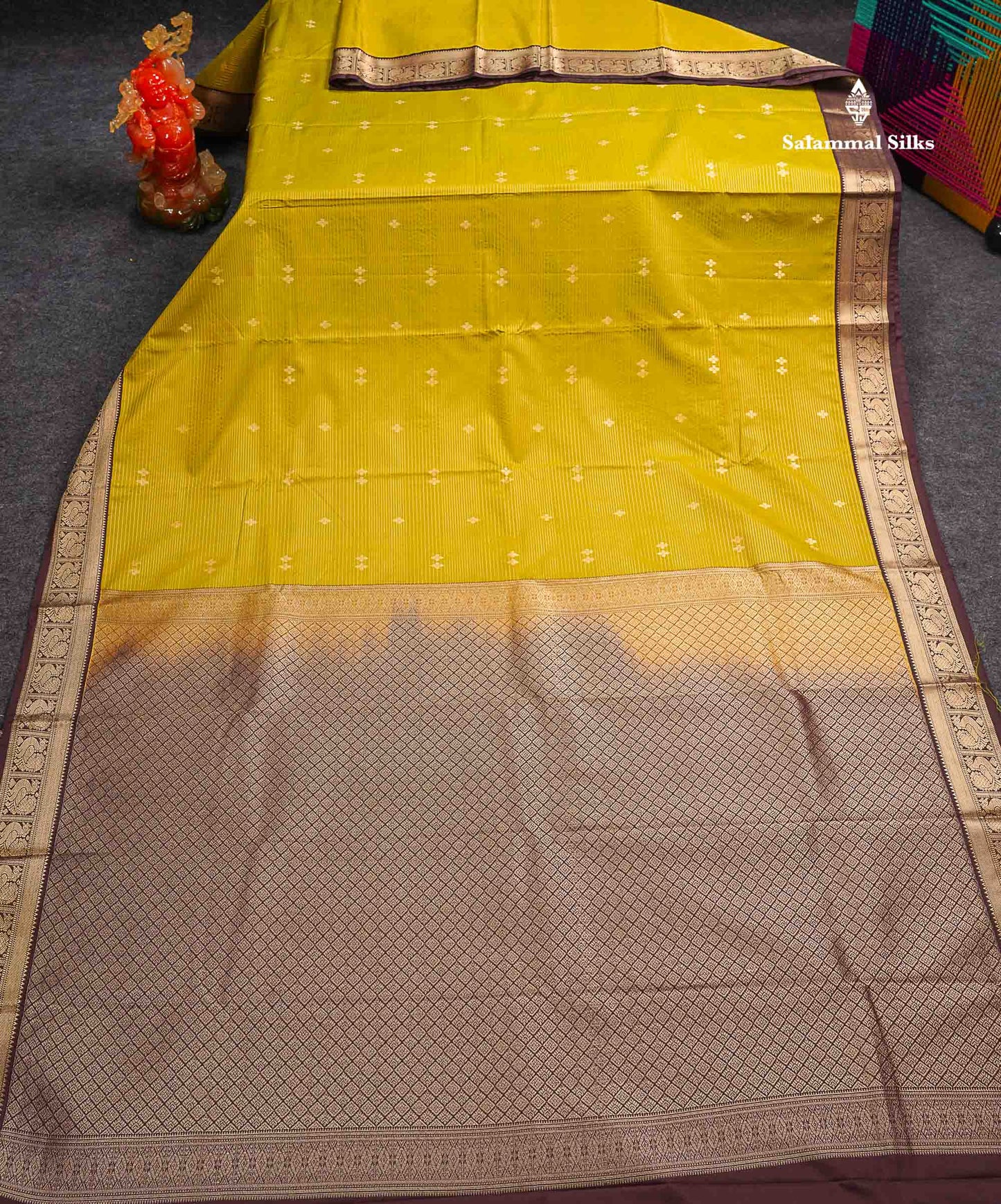 Semi Silk Saree -  Mehandi Green Butta With Vaira Oosi Lines Along With Contrast Dark Brown Small Traditional Border