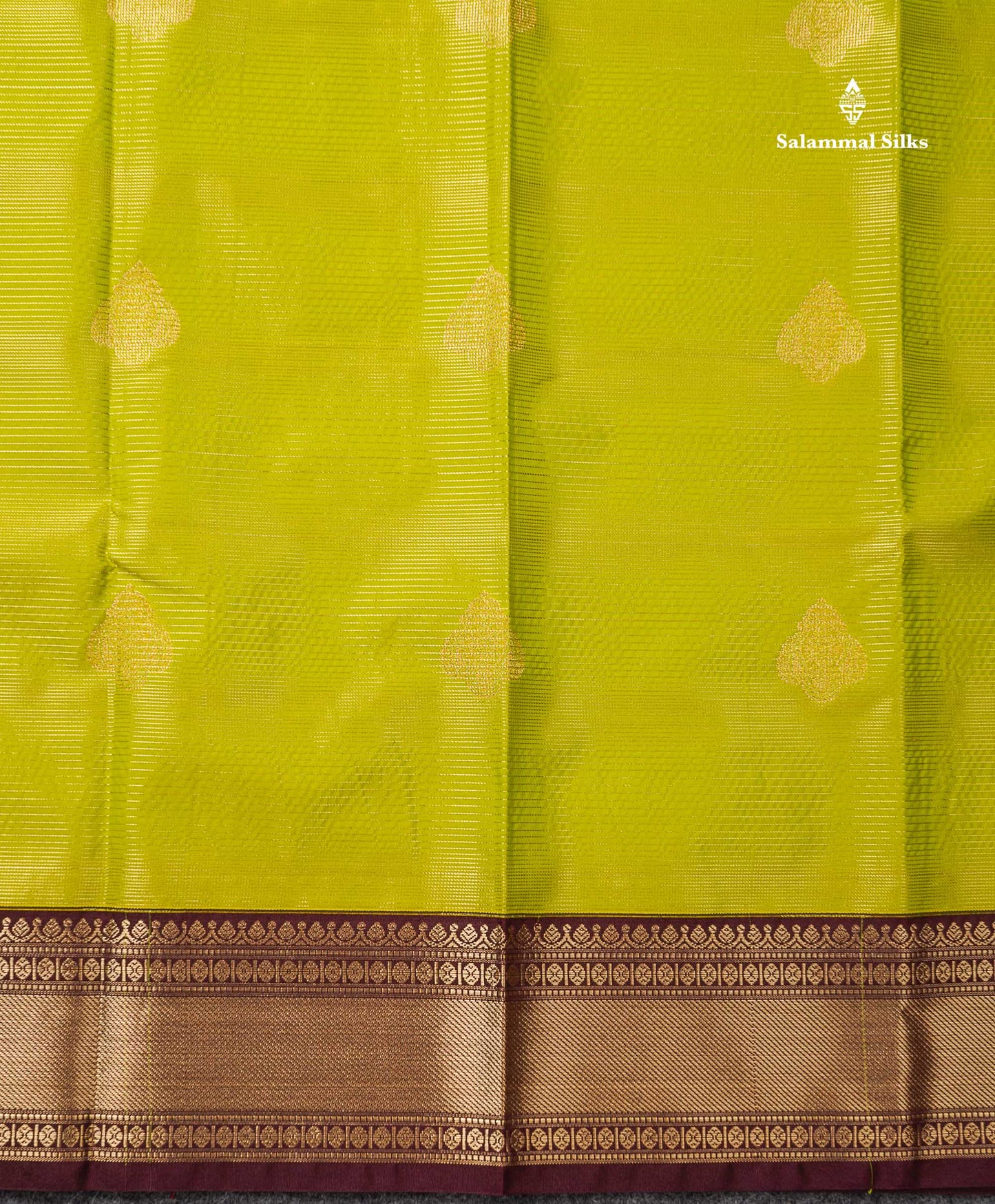 Semi Silk Saree - Parrot Green Alai Vaira Oosi Lines With Butta Along With Contrast Dark Brown Traditional Border