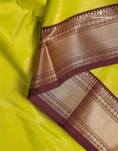 Semi Silk Saree - Parrot Green Alai Vaira Oosi Lines With Butta Along With Contrast Dark Brown Traditional Border