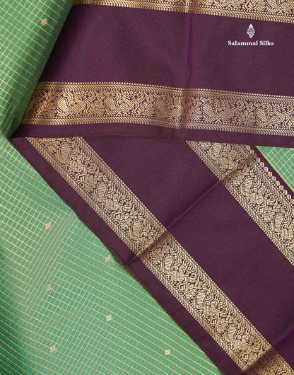 Semi Silk Saree - Dual Tone Light Olive Green Butta With Small Checks Along With Contrast Dark Purple Traditional Gap Border