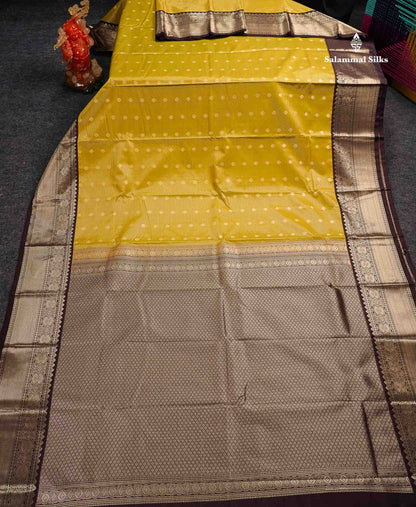 Semi Silk Saree - Olive Mustard Yellow Butta With Vaira Oosi Lines Along With Contrast Dark Brown Border