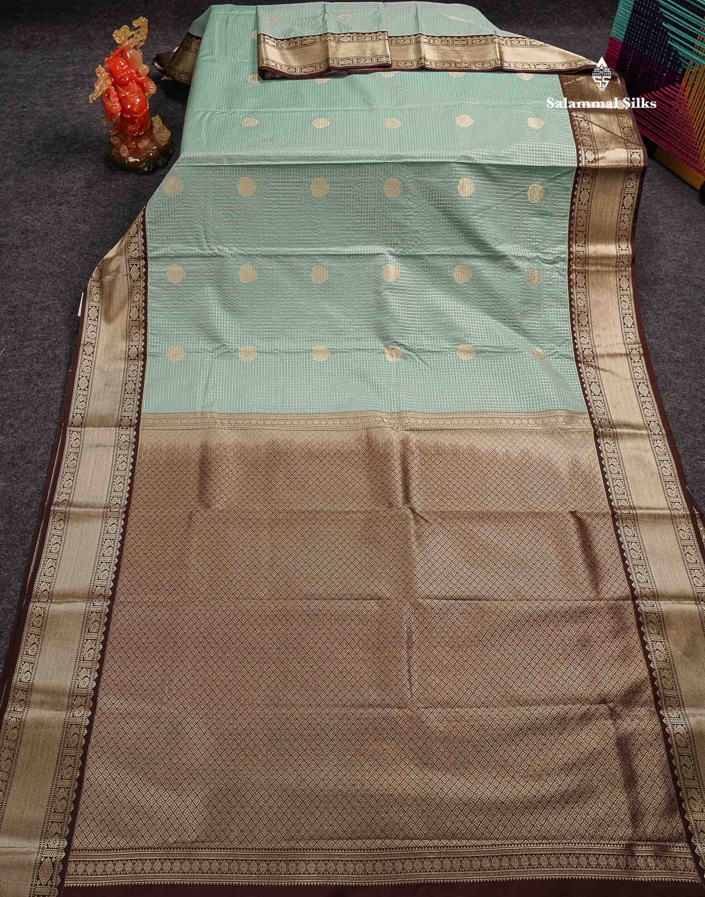 Semi Silk Saree -  Ice Blue Butta With Small Checks Along With Contrast Dark Brown Traditional Border