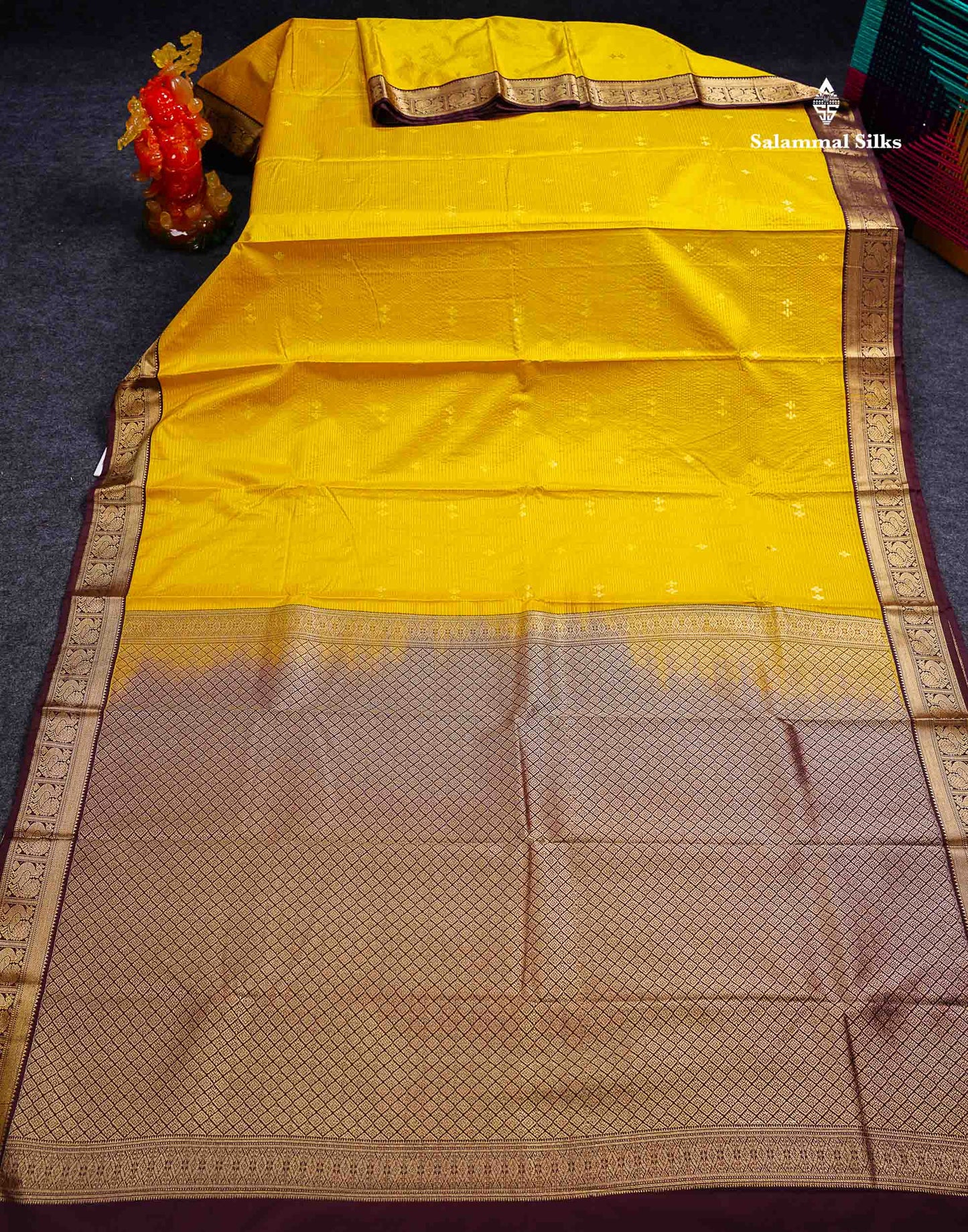 Semi Silk Saree -  Mustard Yellow Butta With Vaira Oosi Lines Along With Contrast Dark Brown Small Traditional Border