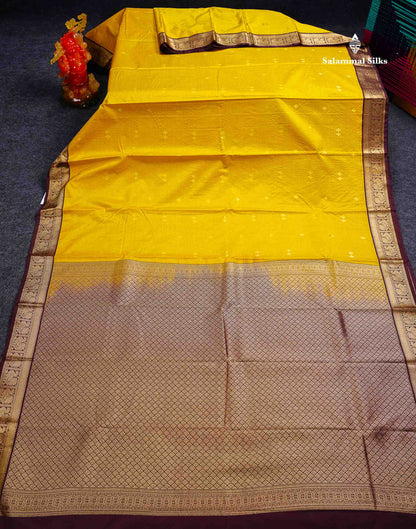 Semi Silk Saree -  Mustard Yellow Butta With Vaira Oosi Lines Along With Contrast Dark Brown Small Traditional Border