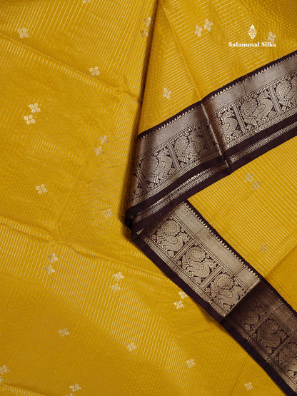 Semi Silk Saree -  Mustard Yellow Butta With Vaira Oosi Lines Along With Contrast Dark Brown Small Traditional Border