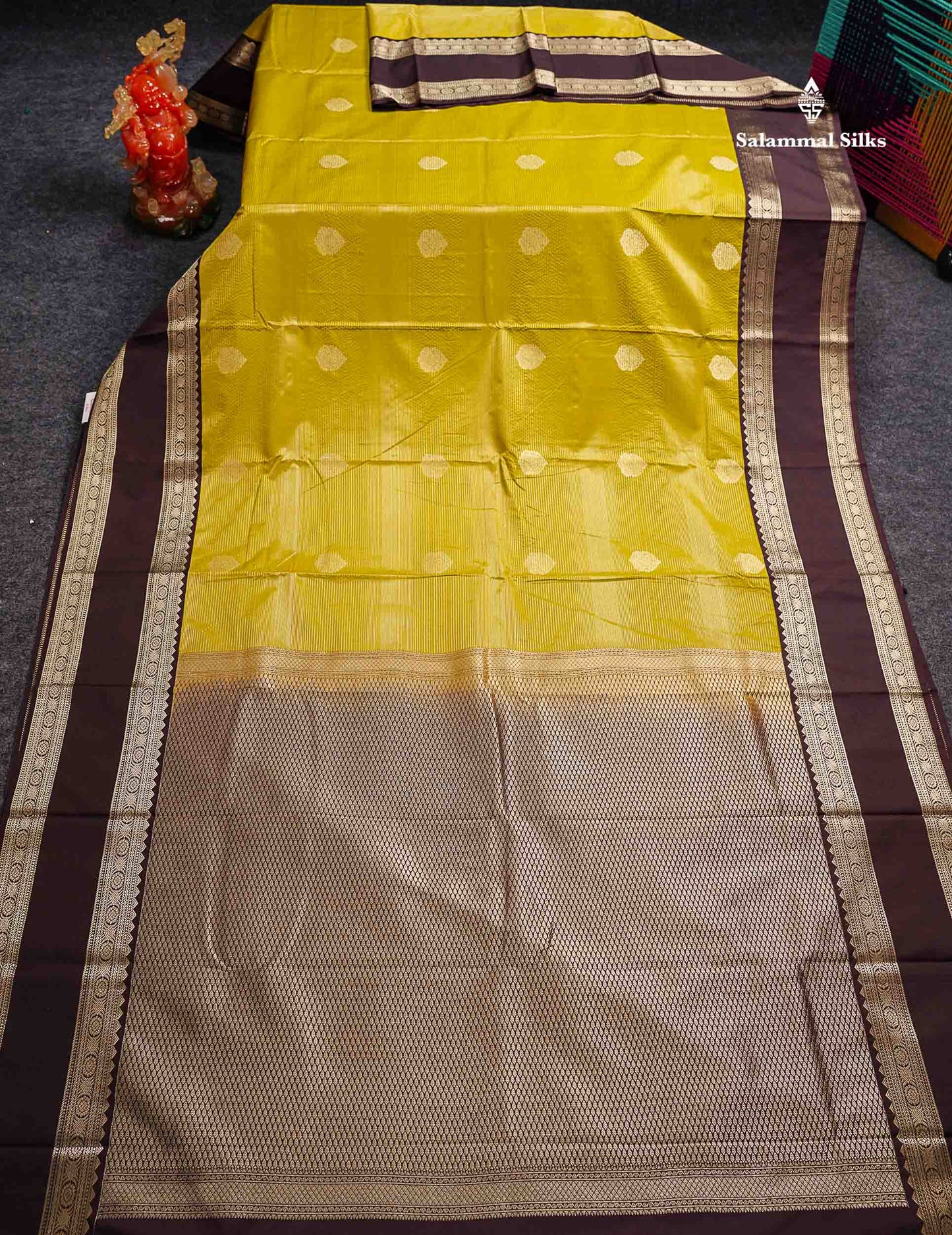 Semi Silk Saree - Manthulir Yellow Butta With Alai Vaira Oosi Lines Along With Contrast Dark Brown Traditional Rettapet Border