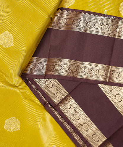 Semi Silk Saree - Manthulir Yellow Butta With Alai Vaira Oosi Lines Along With Contrast Dark Brown Traditional Rettapet Border