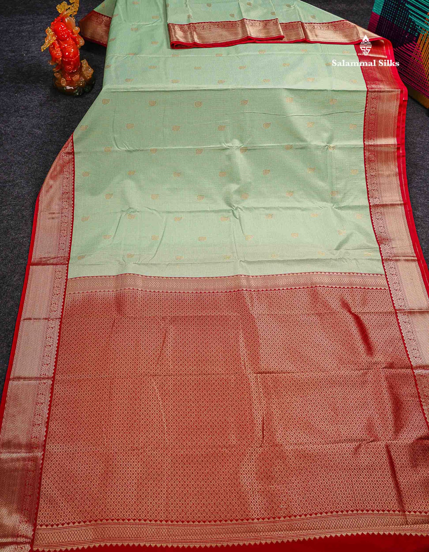 Semi Silk Saree - Light Pista Green Butta With Tiny Vaira Oosi Checks Along With Contrast Red Traditional Border