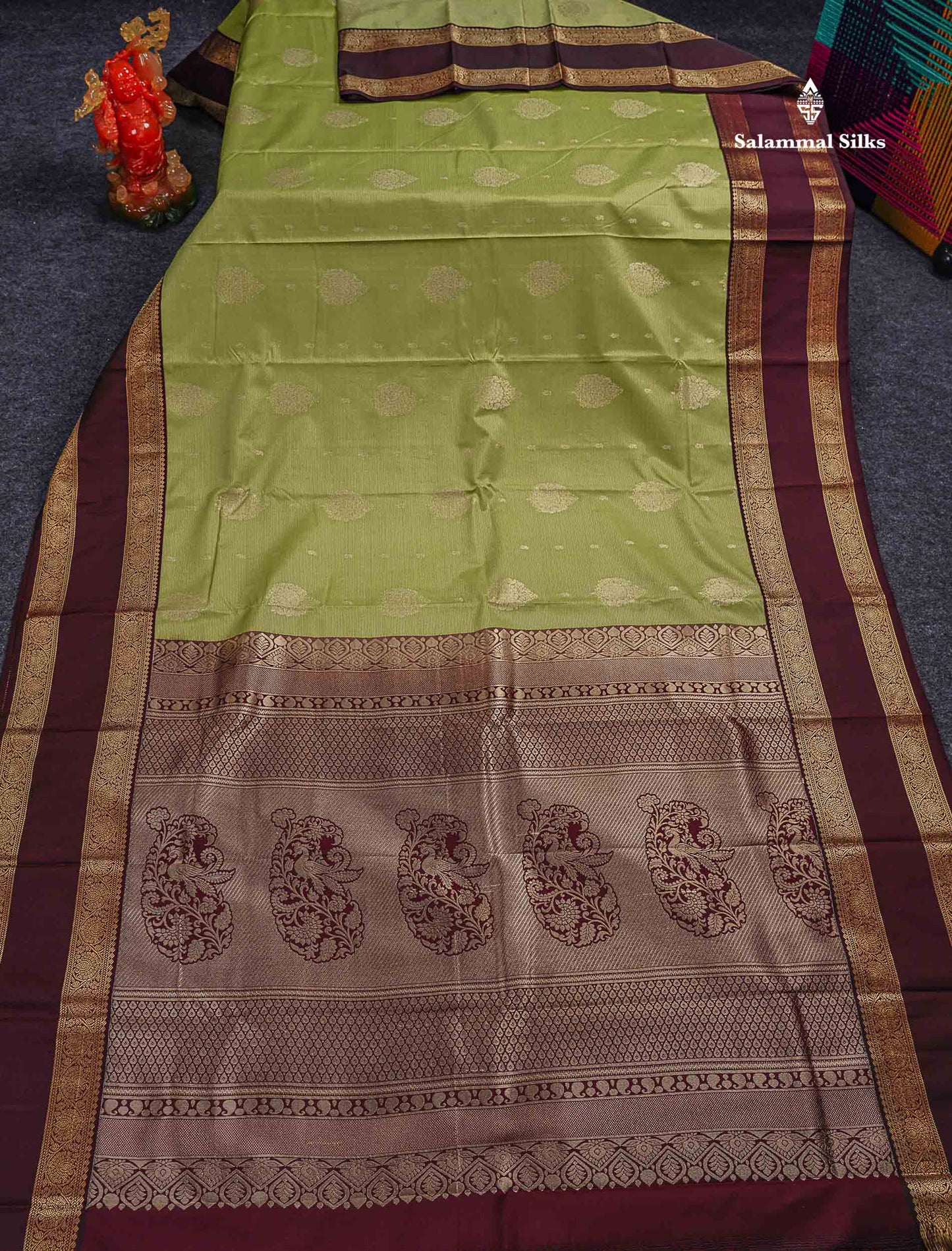 Semi Silk Saree - Pista Green Butta With Vaira Oosi Lines Along With Contrast Dark Brown Traditional Gap Border