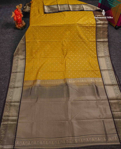 Semi Silk Saree - Mustard Yellow Butta With Small Checks Along With Contrast Snuff Brown Traditional Border