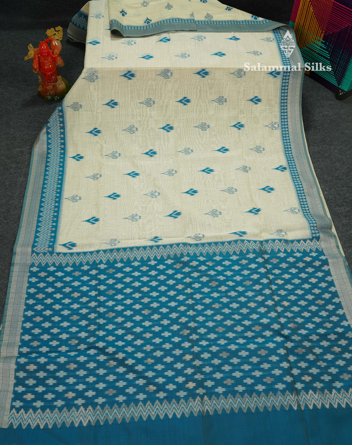 Elegant Cream Sandal Ikkat Style Cotton Mix Saree With Contrast Peacock Blue Border