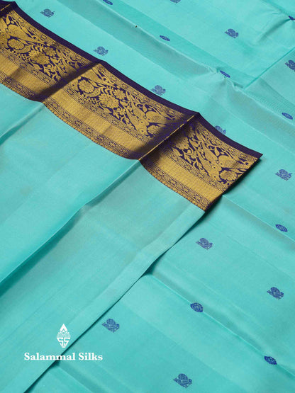 Beautiful Dual Tone Light Blue Peacock & Chakaram Thread Work Butta Pure Kanjivaram Silk Saree With Contrast Navy Blue Traditional Border