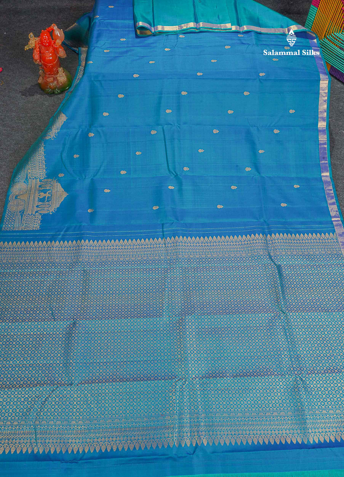 Pure Kanjivaram Silk Saree - Peacock Blue Colour Body With Zari Butta & Traditional Turning Border