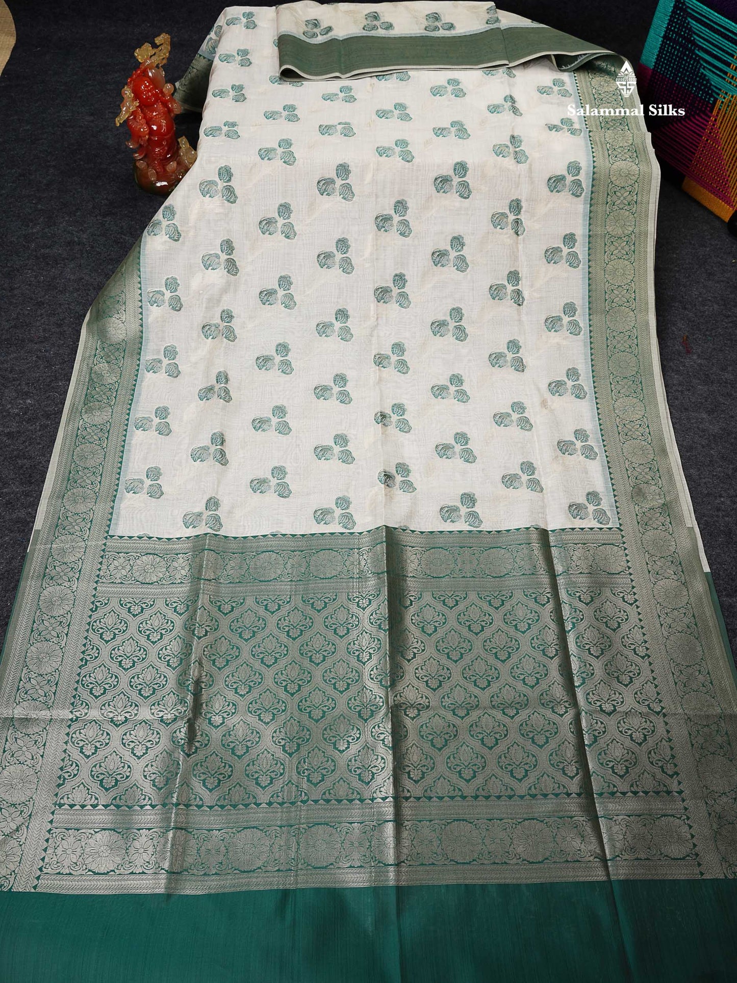 Cotton Mix Saree - Cream Sandal Flower Design Along With Contrast Peacock Green Fancy Border
