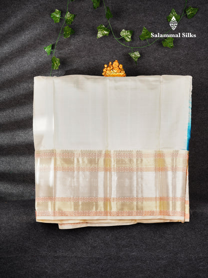 Pure Silk Pattu Pavadai (Dual Tone Peacock Green & Blue ) With Cream Sandal Blouse  44"