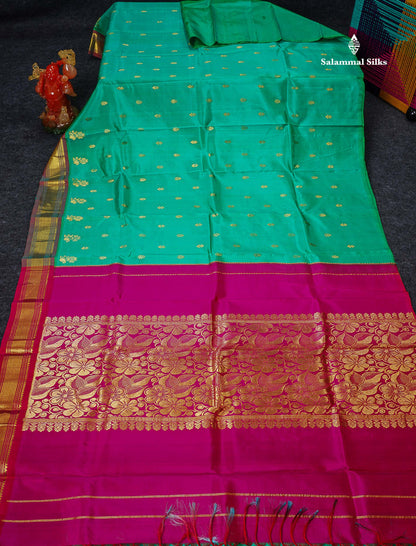 One Side Border Pure Silk Saree - Sapphire Green Zari Butta With Contrast Tomato Red Traditional Border