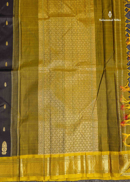 One Side Border Pure Silk Saree - Black Zari Butta With Contrast Manthulir Yellow Traditional Border