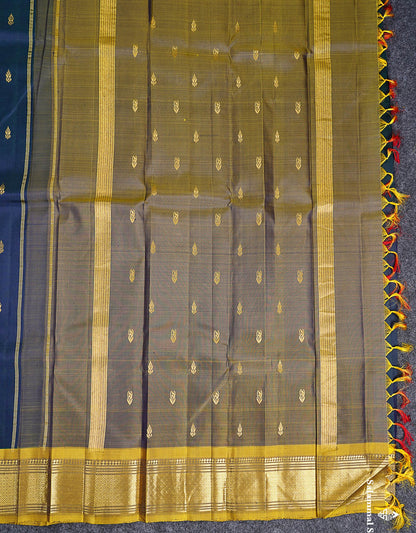 One Side Border Pure Silk Saree - Dual Tone Peacock Blue Zari Butta With Contrast Manthulir Yellow Traditional Border