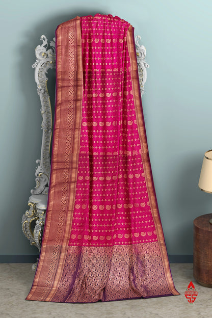 Reddish Pink Semi Soft Silk Saree With Violet Blouse