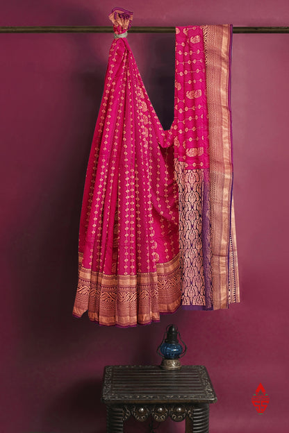 Reddish Pink Semi Soft Silk Saree With Violet Blouse