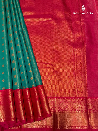 Vairaoosi Sapphire Green Semi Silk Saree With Pink Border