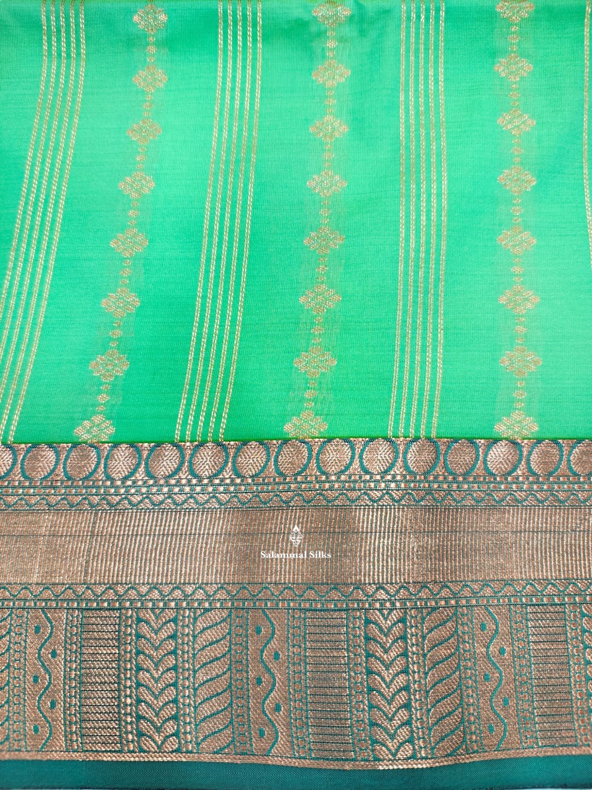 Sapphire Green Semi Soft Silk Saree With Copper Border