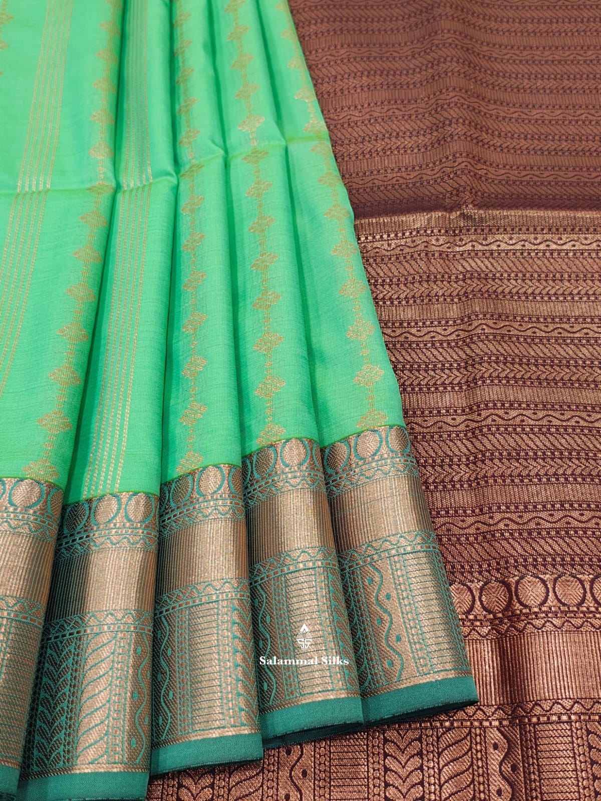 Sapphire Green Semi Soft Silk Saree With Copper Border